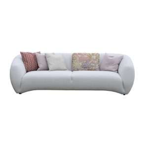 White sofa with cushions and floral accents.