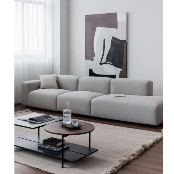 A grey sectional sofa in a contemporary living space.