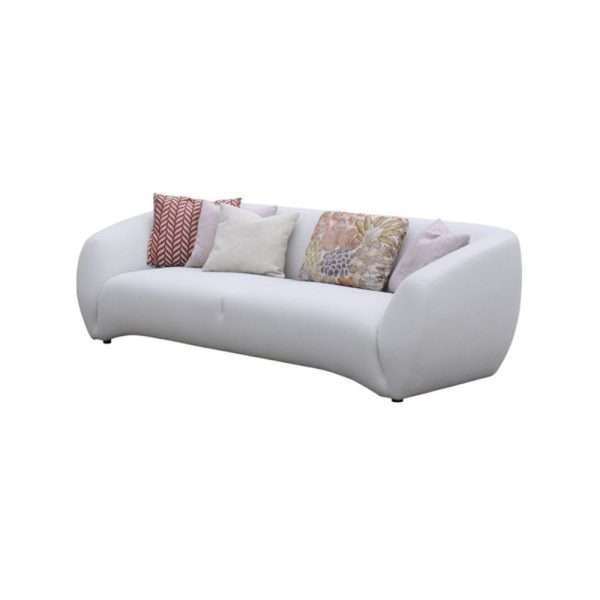 White sofa with patterned pillows, front view.