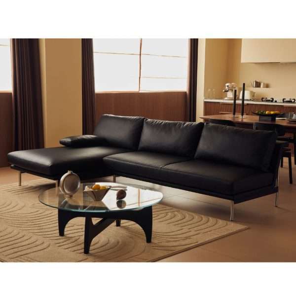 Black leather sectional sofa in a contemporary living room.