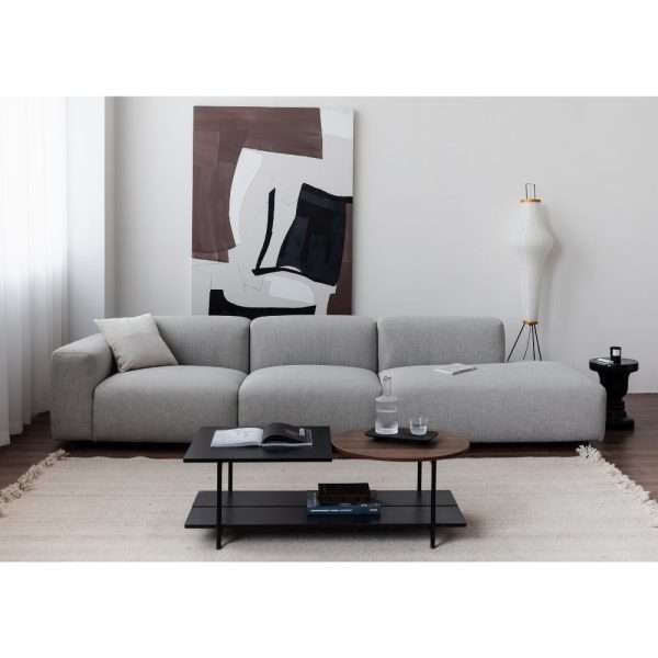 A light grey modern sofa in a minimalist living room.