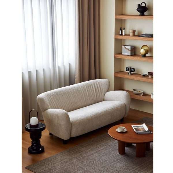 Small beige sofa placed a simple living area