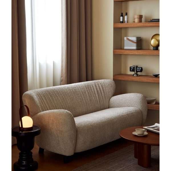 Compact cozy beige sofa in a modern living room.