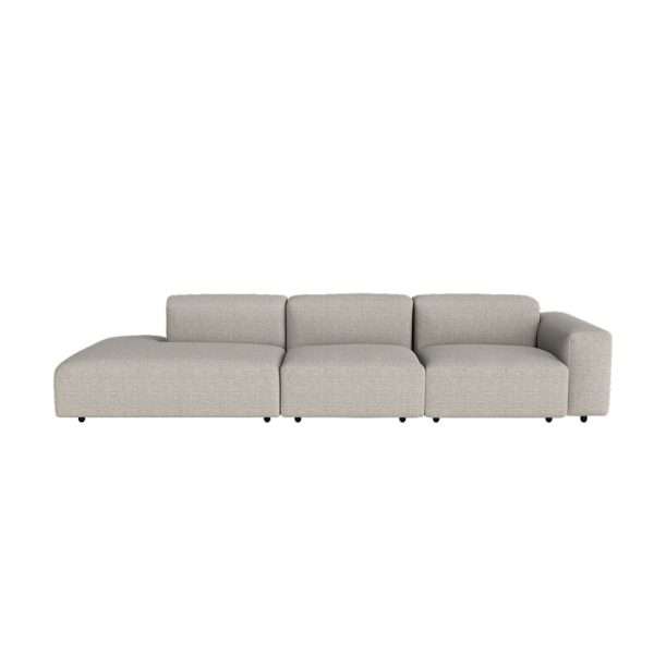 A light grey low-profile sofa with a chaise lounge.