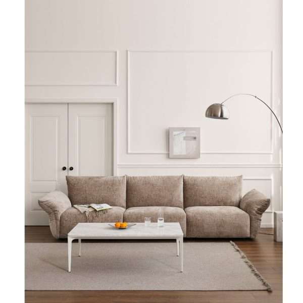 Neutral-toned sofa with a coffee table in a cozy space.