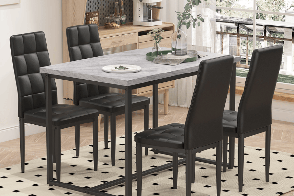 Modern dining table with gray top and black chairs in a stylish kitchen.